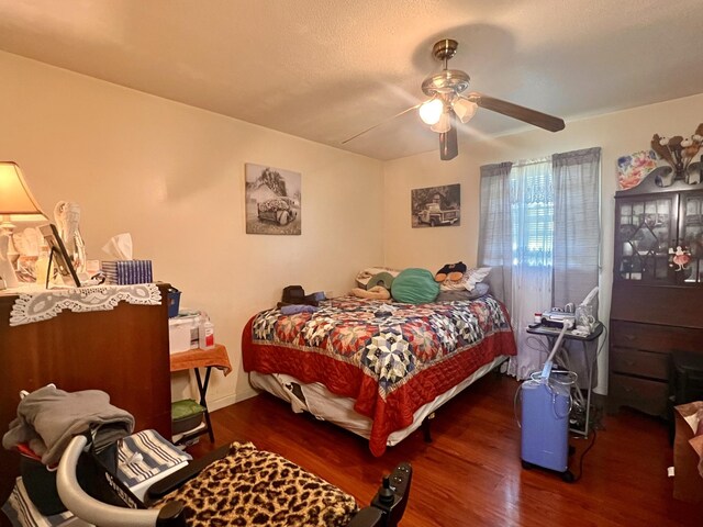 1112 Cumberland St, Decherd, TN 37324 - bedroom with baseboards, a ceiling fan, and wood finished floors