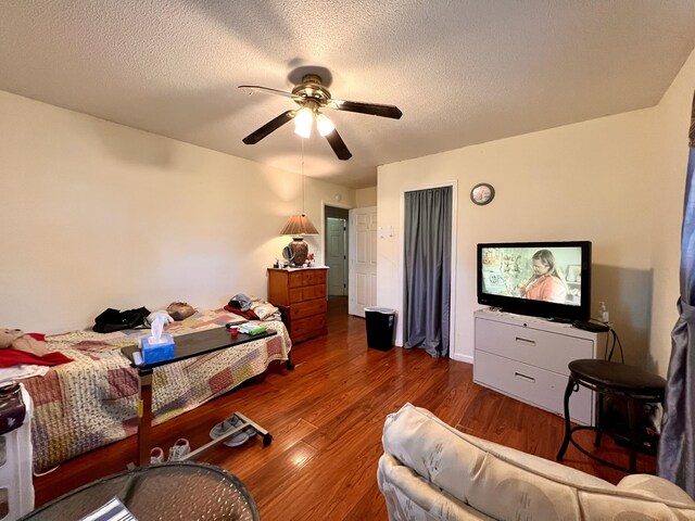 1112 Cumberland St, Decherd, TN 37324 - bedroom featuring a ceiling fan, wood finished floors, and a textured ceiling