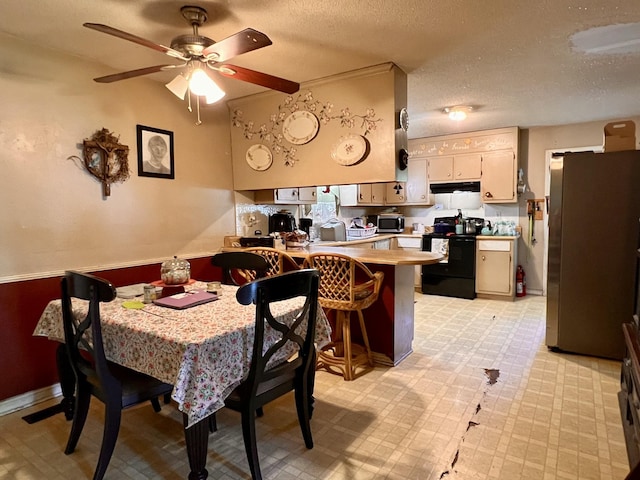 1112 Cumberland St, Decherd, TN 37324 - dining space with light floors, a ceiling fan, and a textured ceiling