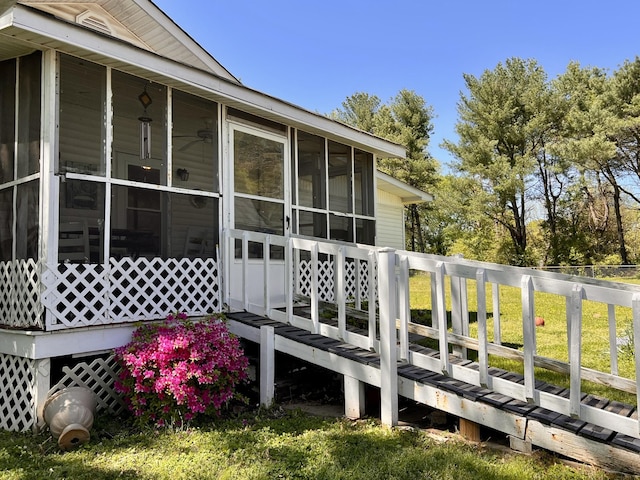 1112 Cumberland St, Decherd, TN 37324 - wooden deck featuring a sunroom
