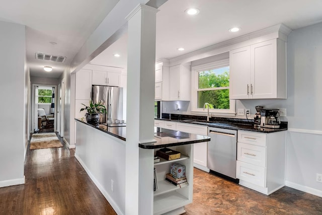 1001 N Graycroft Ave, Madison, TN 37115 - kitchen with visible vents, white cabinetry, and stainless steel appliances