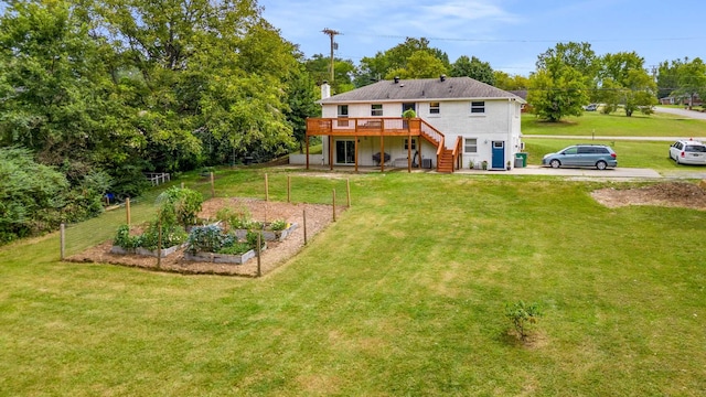 1001 N Graycroft Ave, Madison, TN 37115 - rear view of house featuring stairway, a yard, a garden, and a wooden deck