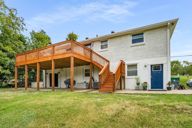 1001 N Graycroft Ave, Madison, TN 37115 - rear view of house with a patio, a lawn, a wooden deck, and stairs