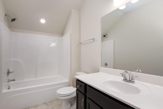 bathroom with toilet, tile patterned floors, vanity, and washtub / shower combination