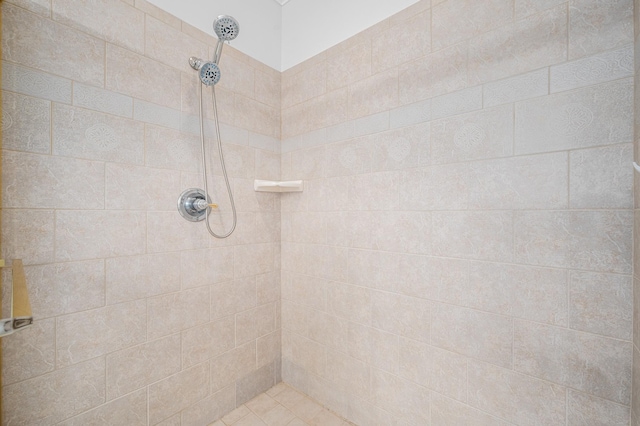 bathroom with a tile shower