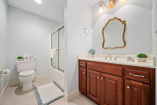 full bath featuring vanity, toilet, combined bath / shower with glass door, tile patterned floors, and baseboards