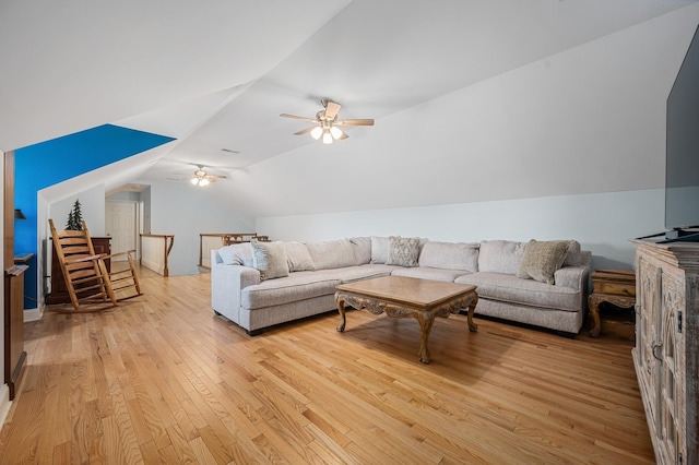 living room with light wood-type flooring, ceiling fan, and lofted ceiling