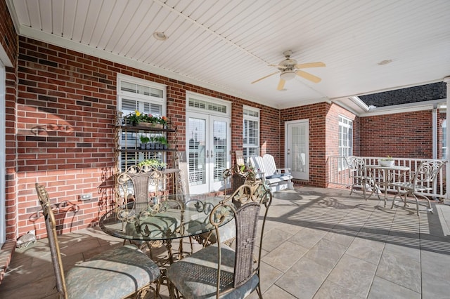 view of patio featuring outdoor dining space and a ceiling fan