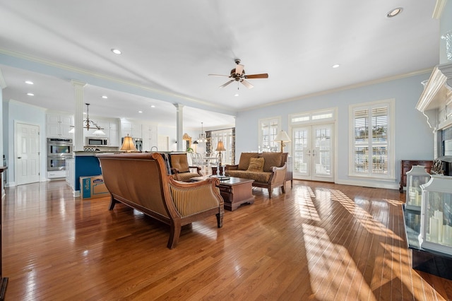 living area featuring ornamental molding, recessed lighting, french doors, ceiling fan, and hardwood / wood-style flooring