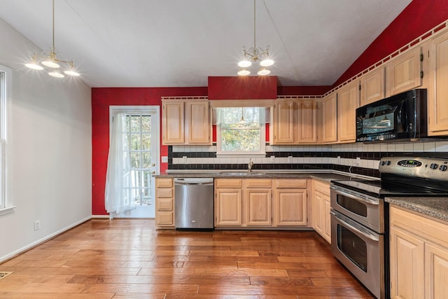 7274 Kingston Rd, Fairview, TN 37062 - kitchen featuring lofted ceiling, dark countertops, stainless steel appliances, and a sink