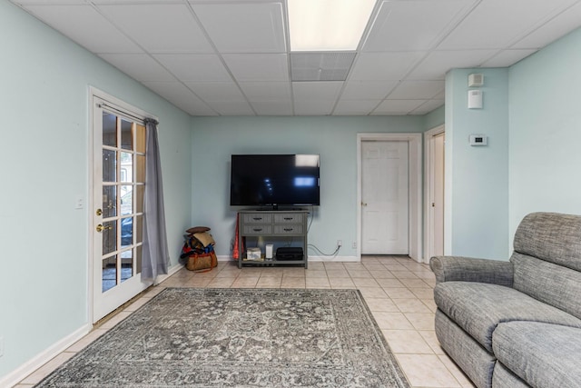 7274 Kingston Rd, Fairview, TN 37062 - living room featuring tile patterned floors, a paneled ceiling, and baseboards