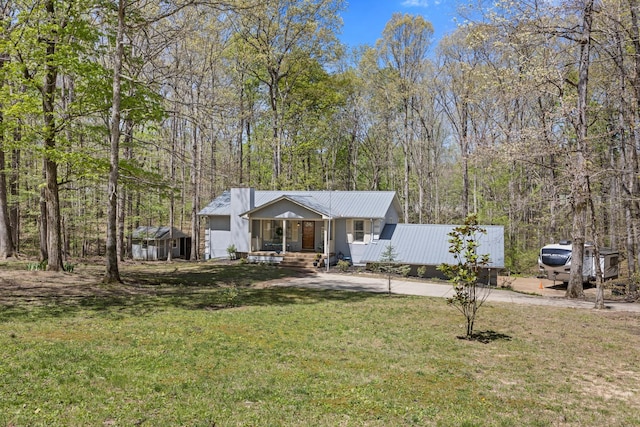 7274 Kingston Rd, Fairview, TN 37062 - view of front of property featuring concrete driveway, a front lawn, covered porch, and metal roof