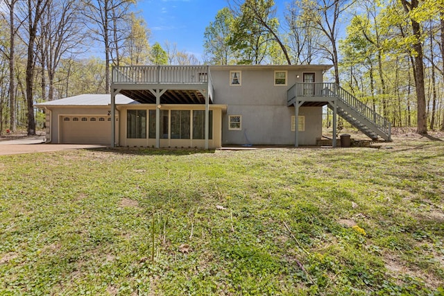 7274 Kingston Rd, Fairview, TN 37062 - rear view of property with concrete driveway, an attached garage, a yard, and stairs