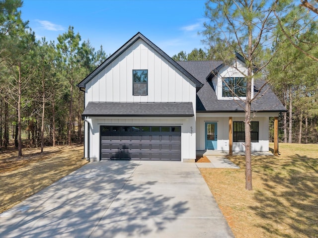 modern farmhouse style home featuring an attached garage, roof with shingles, concrete driveway, and a front lawn