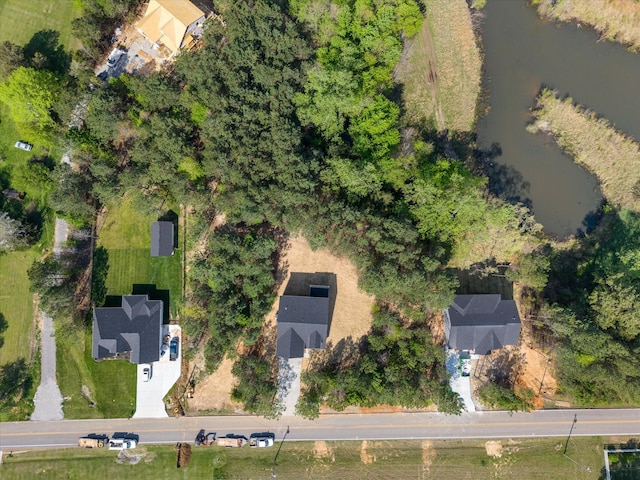birds eye view of property featuring a water view
