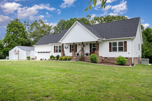 24 Roberts Ridge Rd, Manchester, TN 37355 - view of front of house with covered porch, a shingled roof, an attached garage, and a front yard