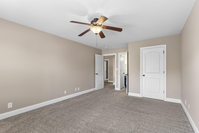 unfurnished bedroom featuring carpet flooring and baseboards