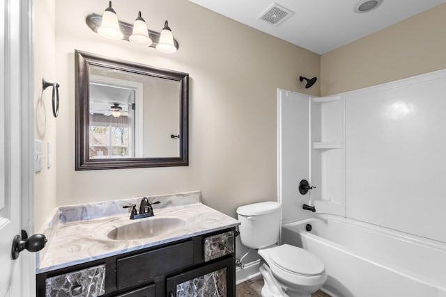 bathroom featuring shower / bathing tub combination, vanity, visible vents, toilet, and baseboards