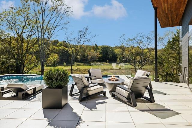 274 Callis Rd, Lebanon, TN 37090 - view of patio / terrace featuring a wooded view, a fire pit, and an outdoor pool