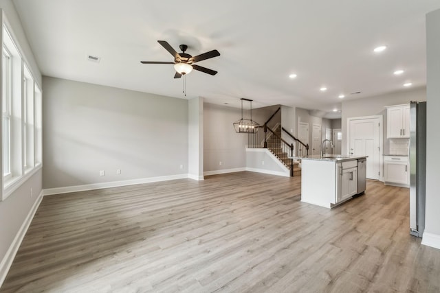 560 Twyla Dr, Lebanon, TN 37087 - kitchen featuring recessed lighting, open floor plan, stainless steel appliances, a center island with sink, and light wood-type flooring