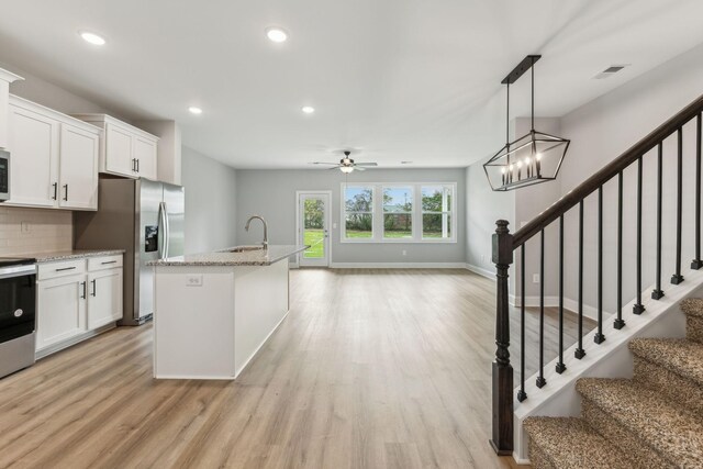 560 Twyla Dr, Lebanon, TN 37087 - kitchen with stainless steel appliances, ceiling fan, light wood finished floors, and recessed lighting