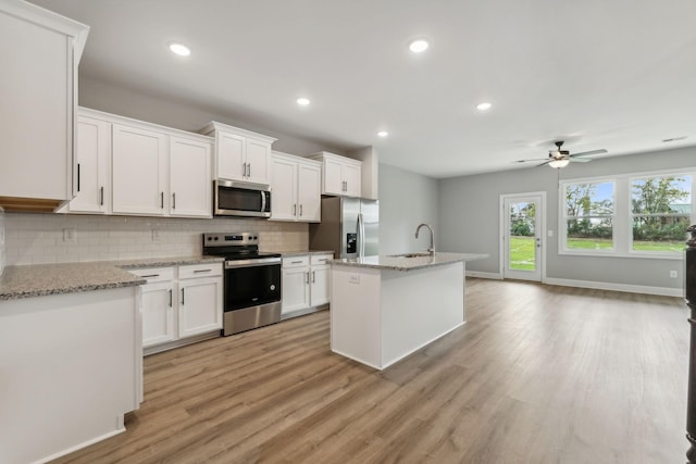560 Twyla Dr, Lebanon, TN 37087 - kitchen featuring stainless steel appliances, tasteful backsplash, ceiling fan, white cabinets, and recessed lighting