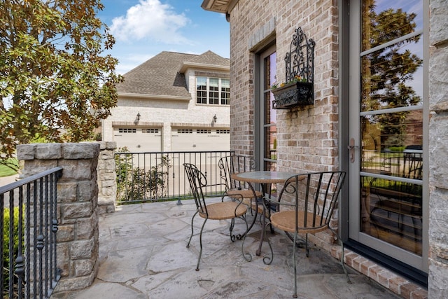 1499 Boardwalk Pl, Gallatin, TN 37066 - view of patio / terrace featuring an attached garage