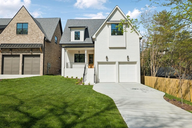 4201A Belmont Blvd, Nashville, TN 37215 - view of front of property with a front yard, an attached garage, covered porch, brick siding, and driveway