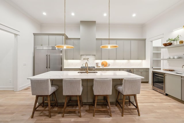 4201A Belmont Blvd, Nashville, TN 37215 - kitchen featuring stainless steel built in fridge, wall chimney exhaust hood, beverage cooler, and crown molding
