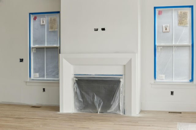 details featuring wood finished floors and visible vents