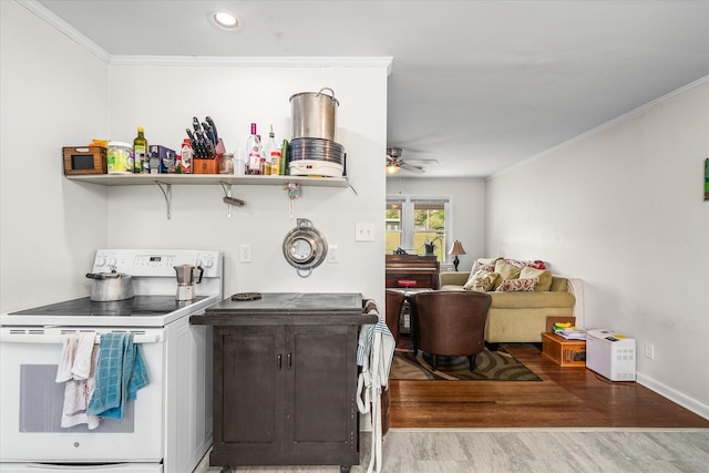 interior space with recessed lighting, wood finished floors, a ceiling fan, and ornamental molding