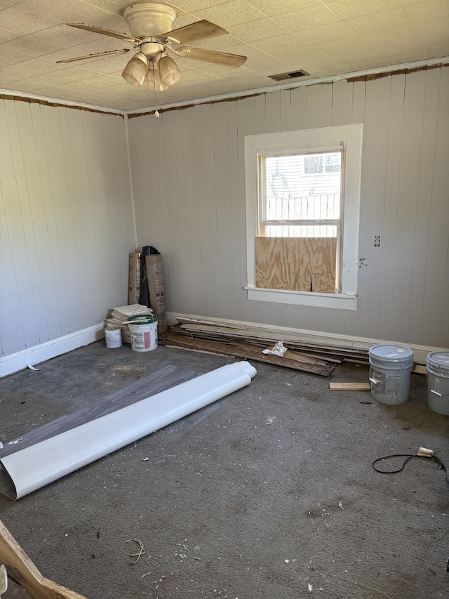 spare room featuring visible vents and ceiling fan