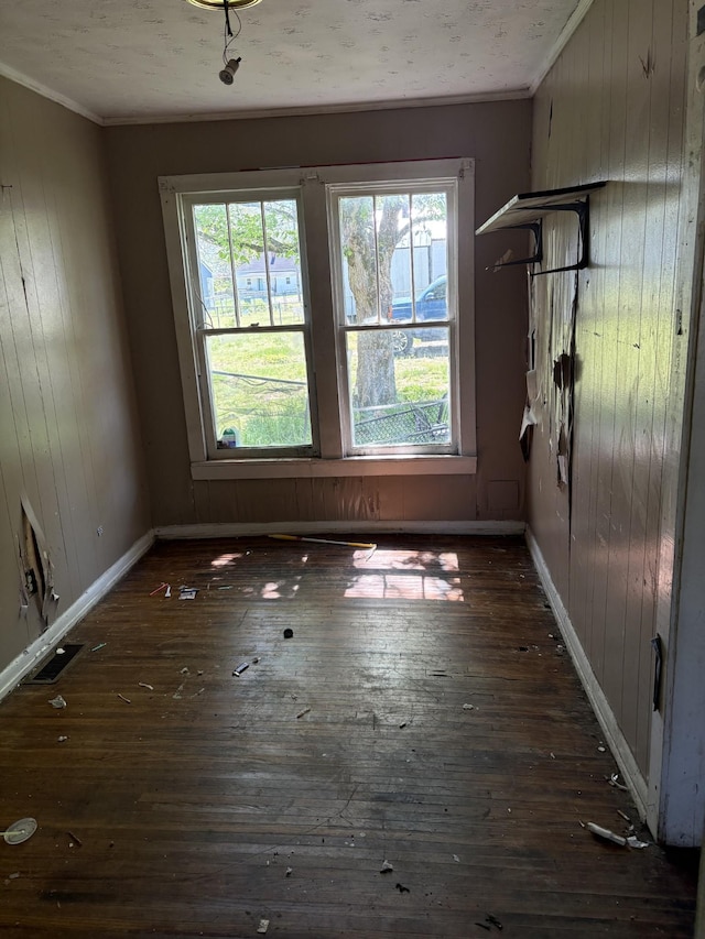 755 Center St, Lewisburg, TN 37091 - unfurnished dining area featuring crown molding, dark wood-style flooring, and wooden walls