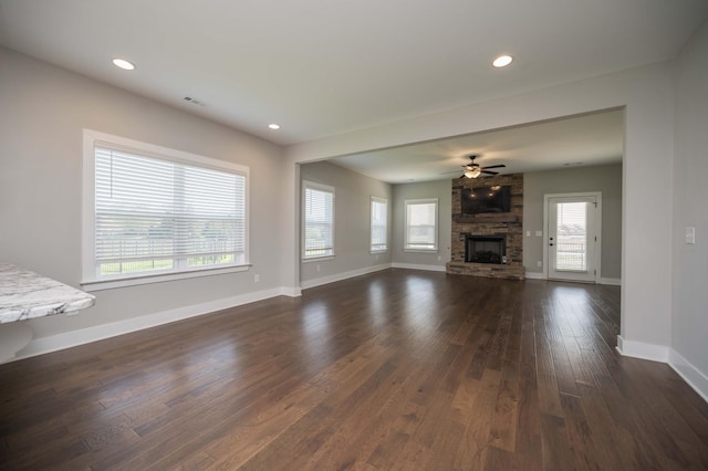 4302 Peacemill Ln, Murfreesboro, TN 37128 - unfurnished living room featuring a stone fireplace, plenty of natural light, dark wood finished floors, ceiling fan, and recessed lighting