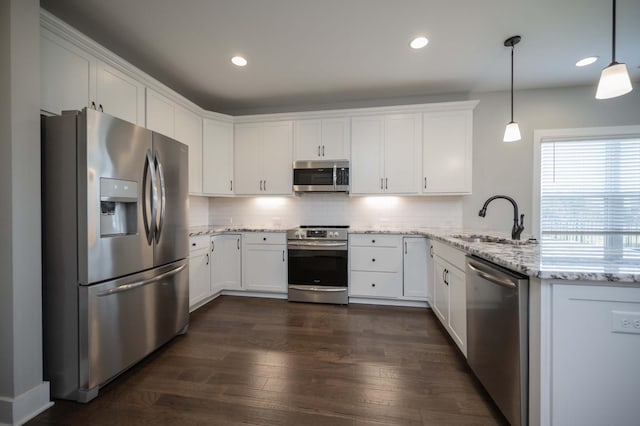 4302 Peacemill Ln, Murfreesboro, TN 37128 - kitchen featuring stainless steel appliances, white cabinets, a peninsula, decorative backsplash, and dark wood-style floors