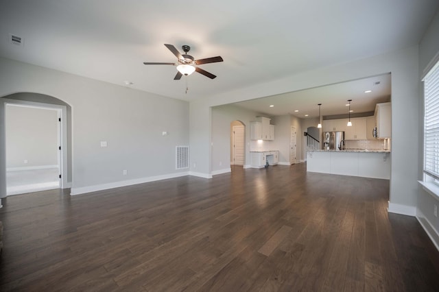 4302 Peacemill Ln, Murfreesboro, TN 37128 - unfurnished living room featuring arched walkways, a ceiling fan, dark wood-type flooring, and recessed lighting