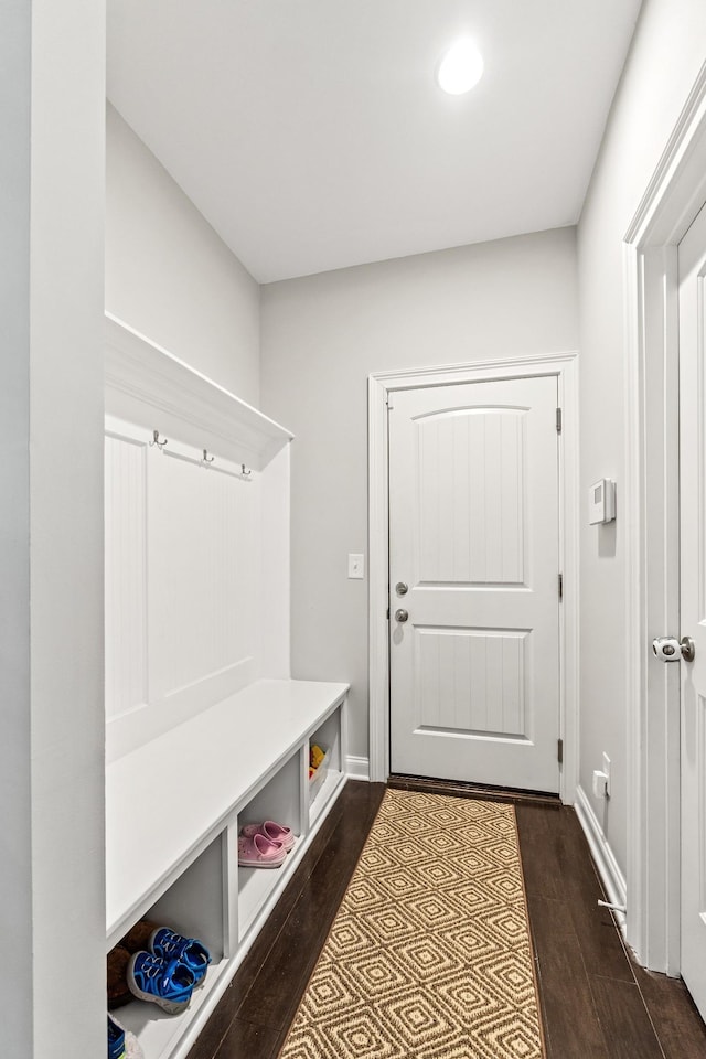 mudroom featuring baseboards, recessed lighting, and dark wood finished floors