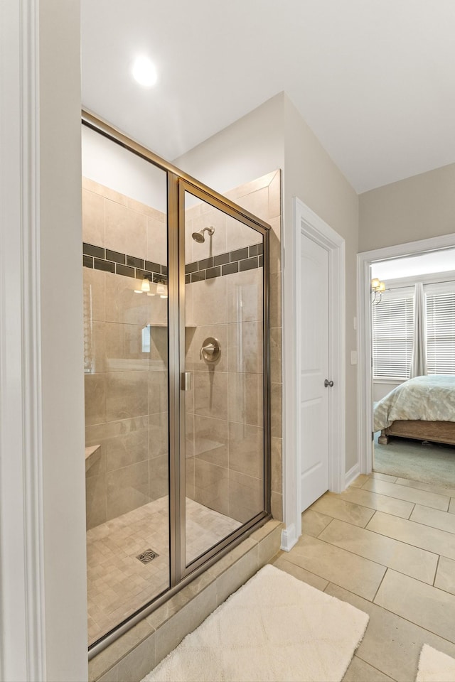 full bathroom with tile patterned floors, connected bathroom, and a stall shower