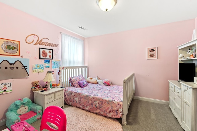 carpeted bedroom featuring visible vents and baseboards