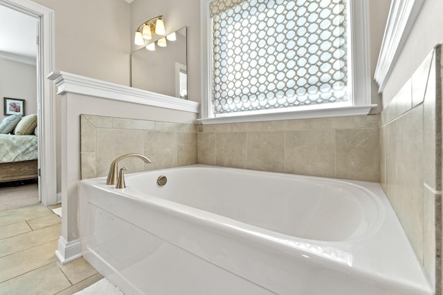 ensuite bathroom with a bath, tile patterned flooring, and connected bathroom