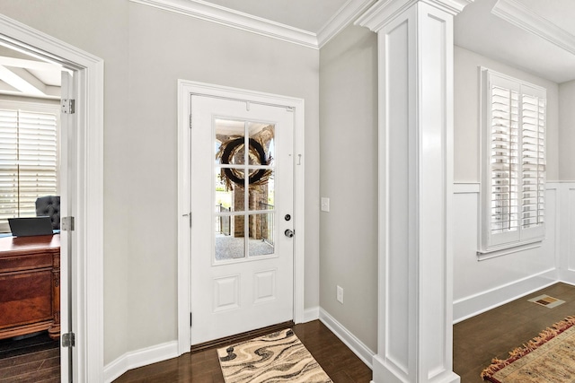 doorway to outside with dark wood-style flooring, ornamental molding, visible vents, and a healthy amount of sunlight