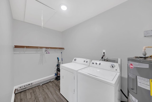305 Thomas Ave, Hohenwald, TN 38462 - washroom with independent washer and dryer, laundry area, water heater, light wood-style flooring, and baseboards
