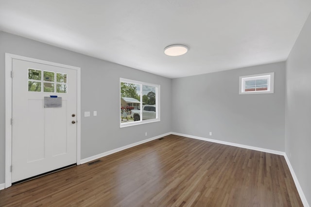 305 Thomas Ave, Hohenwald, TN 38462 - entryway featuring baseboards, visible vents, and wood finished floors
