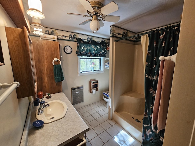 50 Deaton Ln, Parsons, TN 38363 - bathroom featuring vanity, a ceiling fan, tile patterned flooring, a stall shower, and heating unit