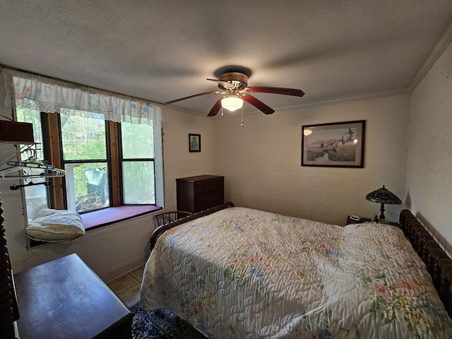 50 Deaton Ln, Parsons, TN 38363 - bedroom featuring a ceiling fan, a textured ceiling, and ornamental molding