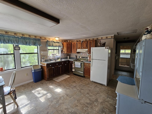 50 Deaton Ln, Parsons, TN 38363 - kitchen featuring stainless steel electric range oven, light countertops, freestanding refrigerator, a textured ceiling, and under cabinet range hood