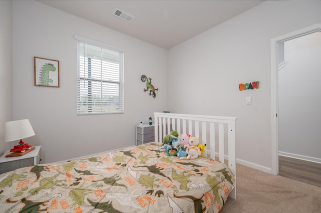 bedroom with visible vents, baseboards, and carpet flooring