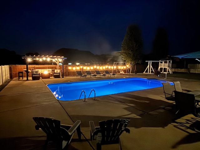 414 Beaumont Dr, Murfreesboro, TN 37129 - pool at night featuring a patio and an outdoor hangout area
