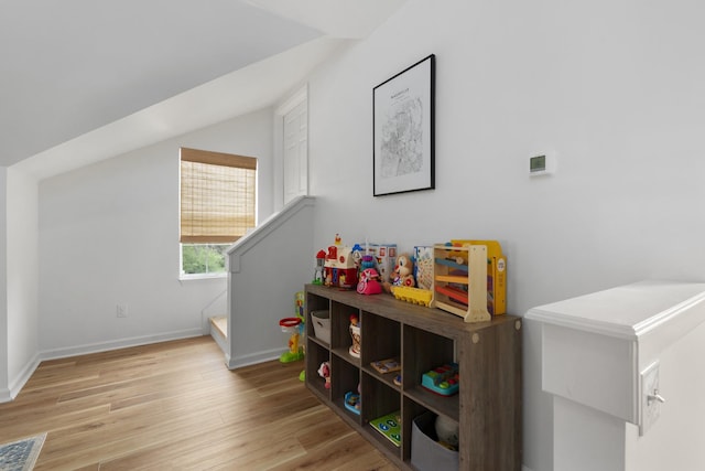 rec room with visible vents, baseboards, and light wood-type flooring