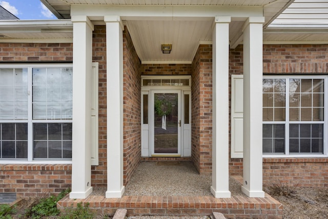 entrance to property with brick siding